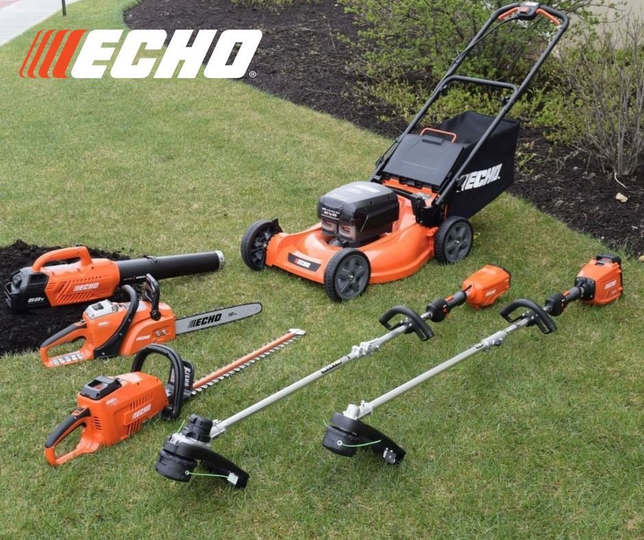 A lawn mower is sitting on top of a lush green lawn