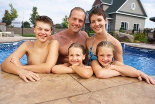 Family in a heated swimming pool
