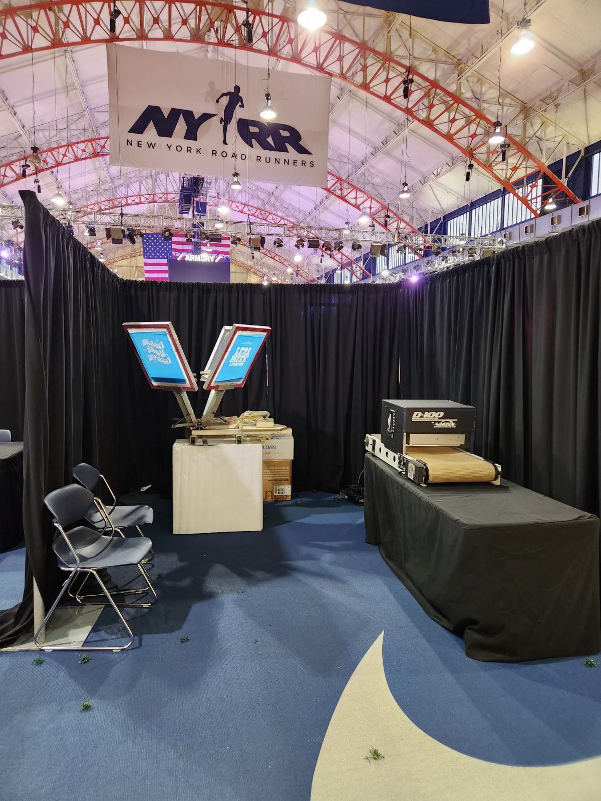 a booth with a sign that says NY t-shirt