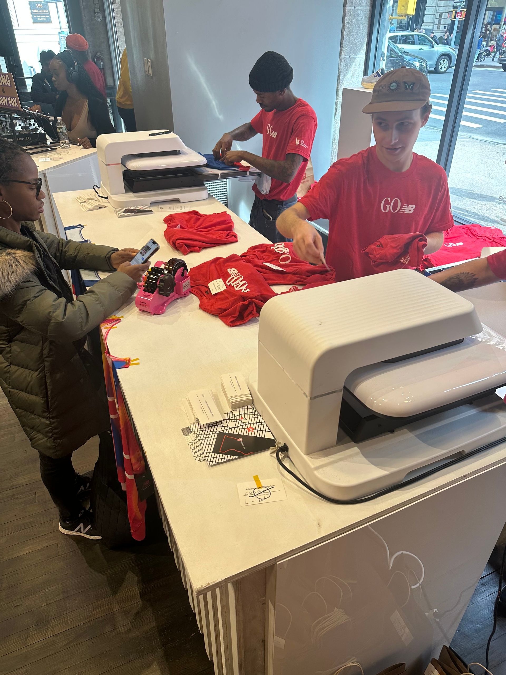 a group of people are working on a machine in a store