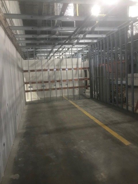 There is a yellow line on the floor in the middle of the room.