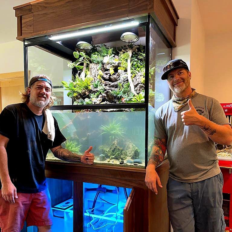 Premier Aquarium Service installing a new aquarium tank.