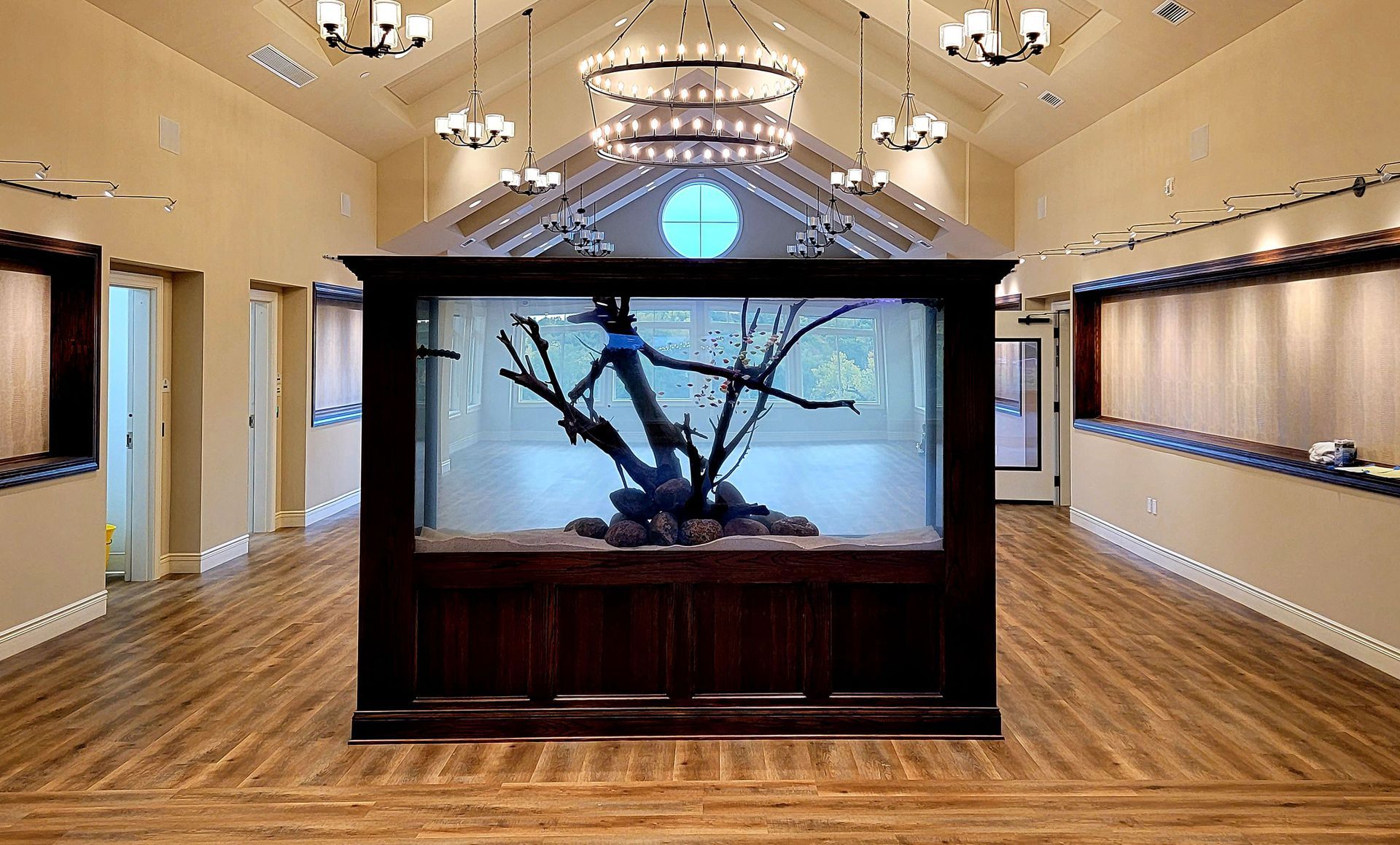 There is a large aquarium in the middle of the room.