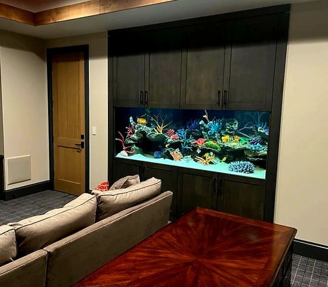 There is a large aquarium in the middle of the room.