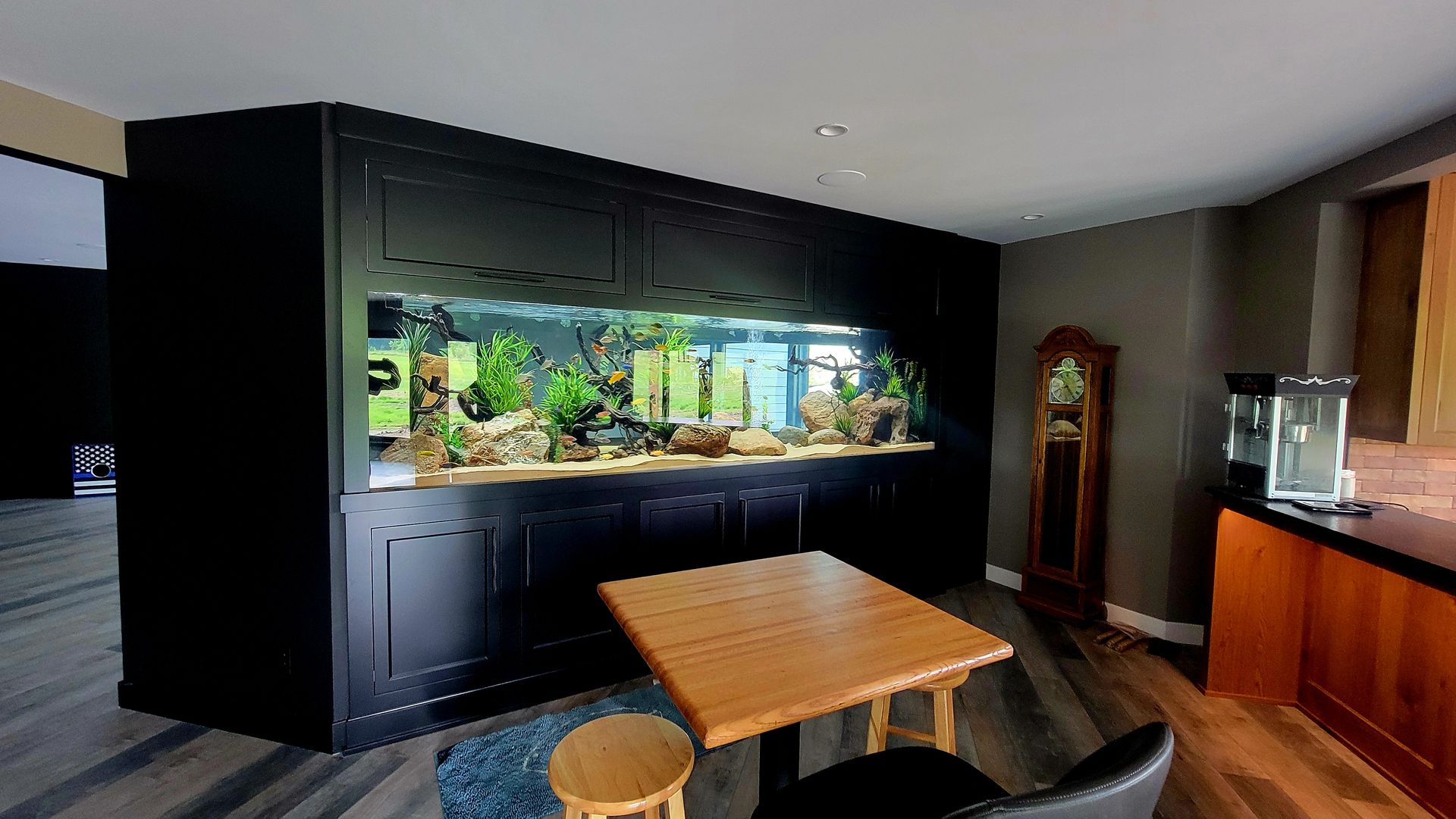 There is a large aquarium in the middle of the room.