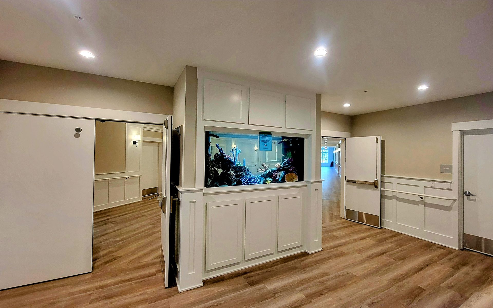 There is a large aquarium in the middle of the room.