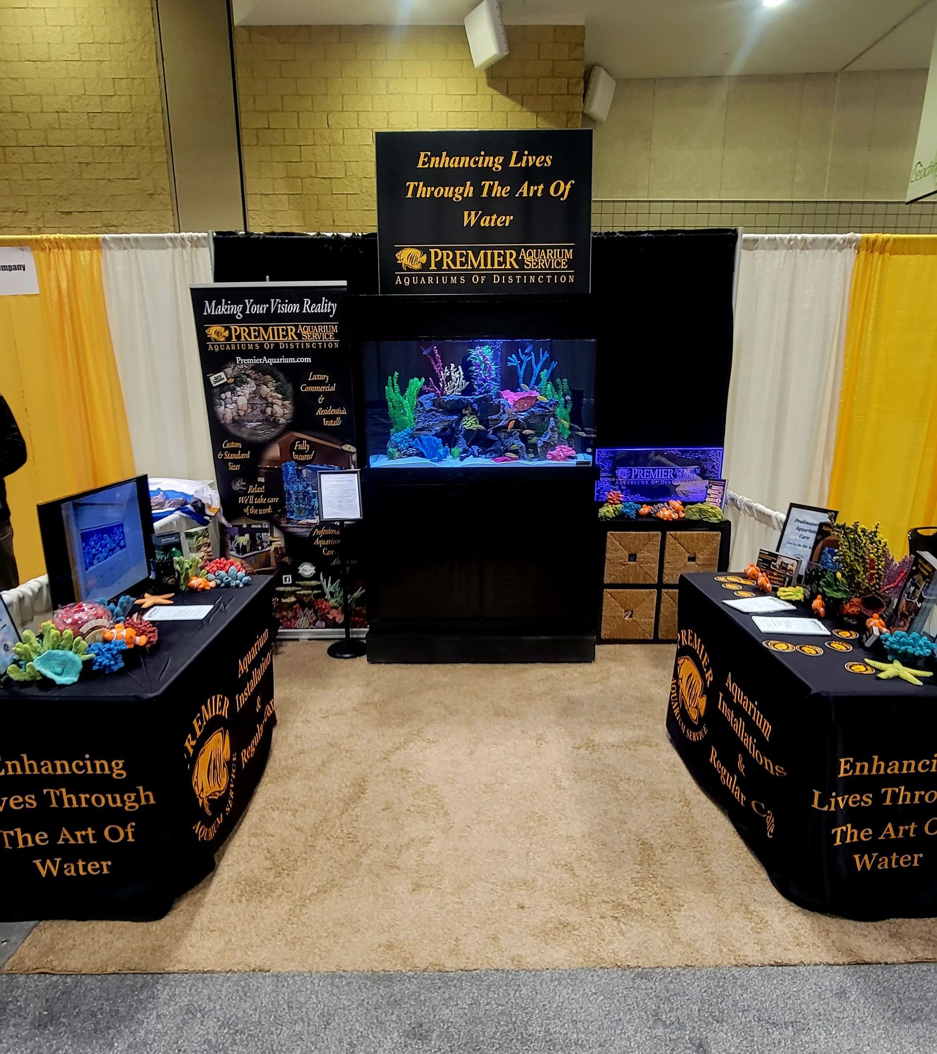 A booth with a sign that says ' aquarium ' on it