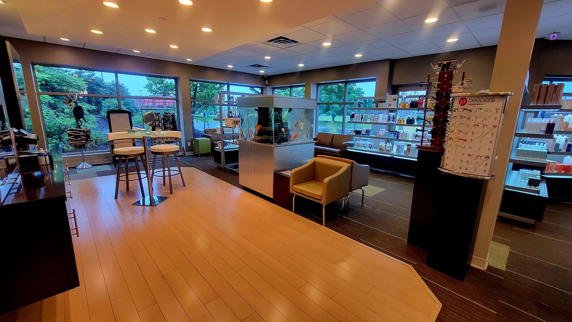 A large room with a lot of windows and furniture