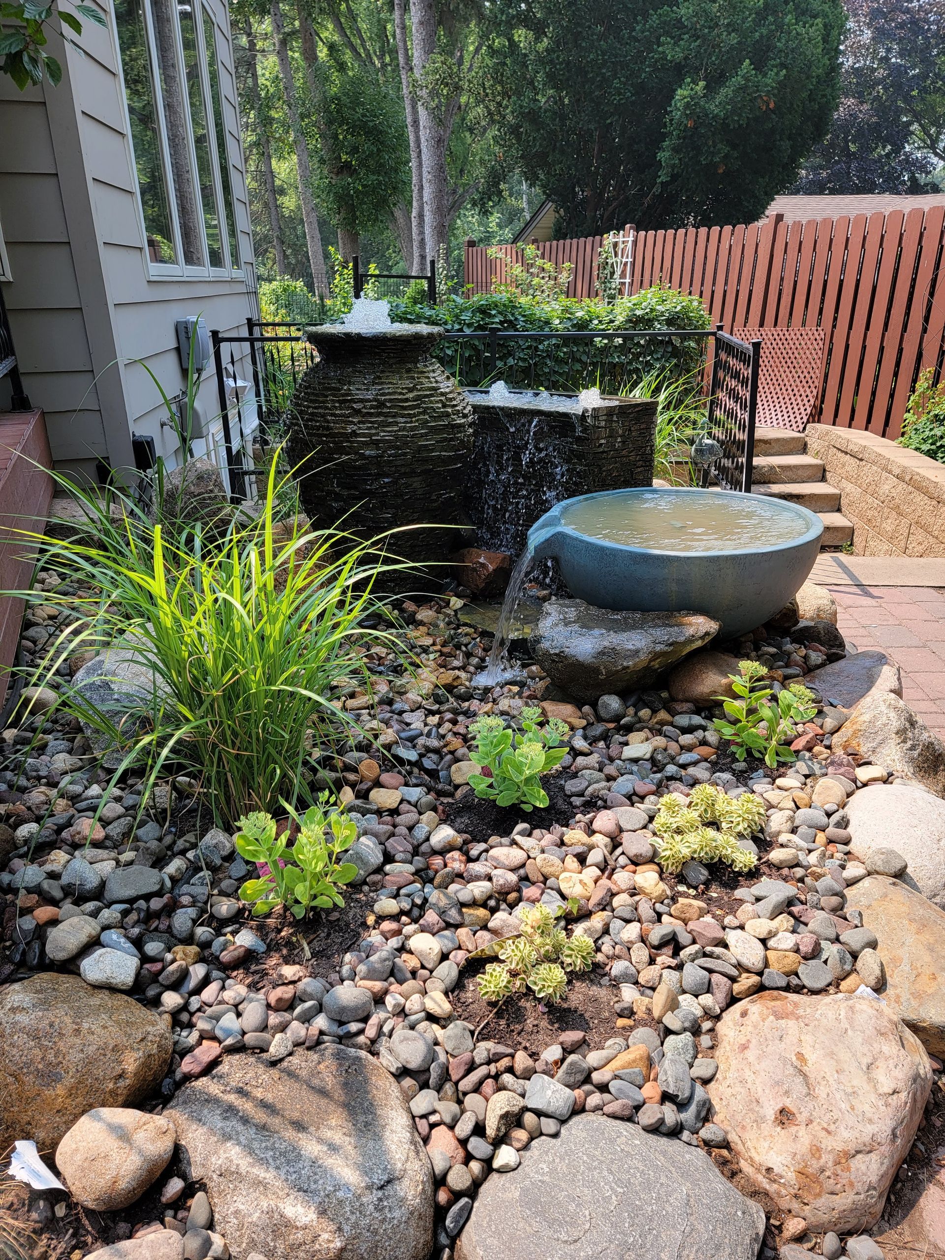 There is a waterfall in the middle of the garden.
