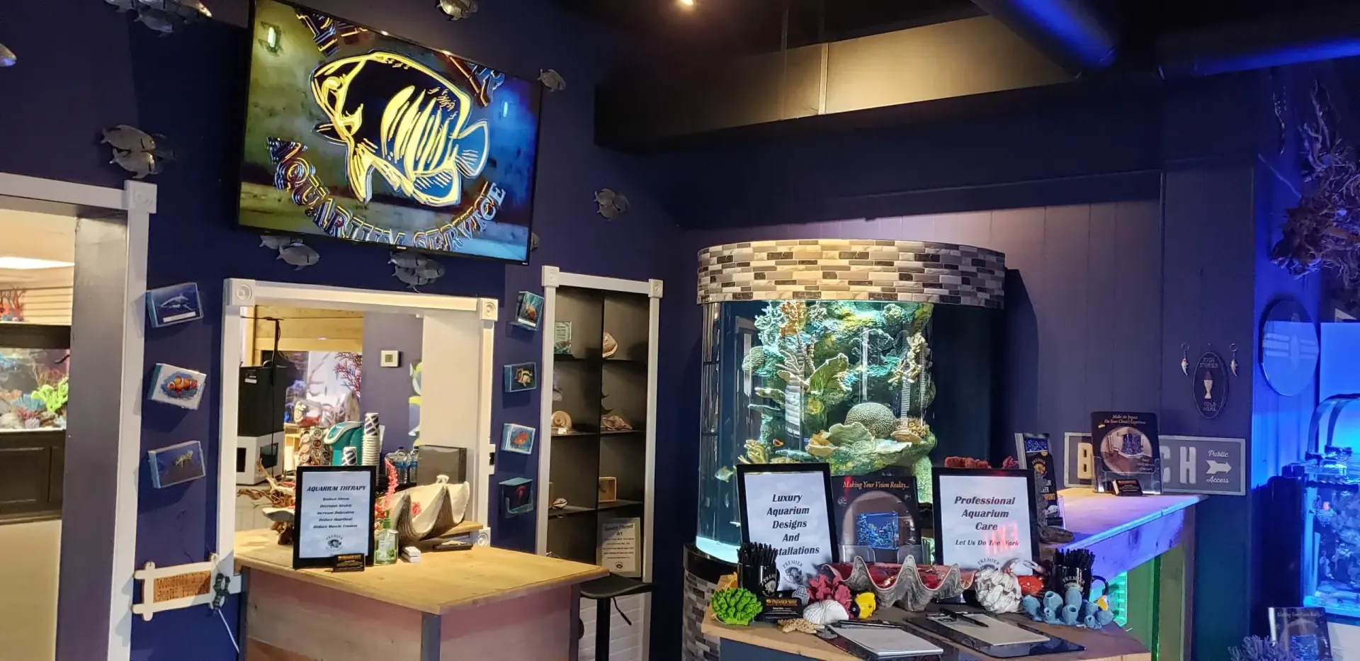 There is a large aquarium in the background of the room.