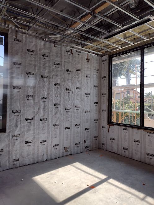 A room with a lot of insulation on the walls and windows