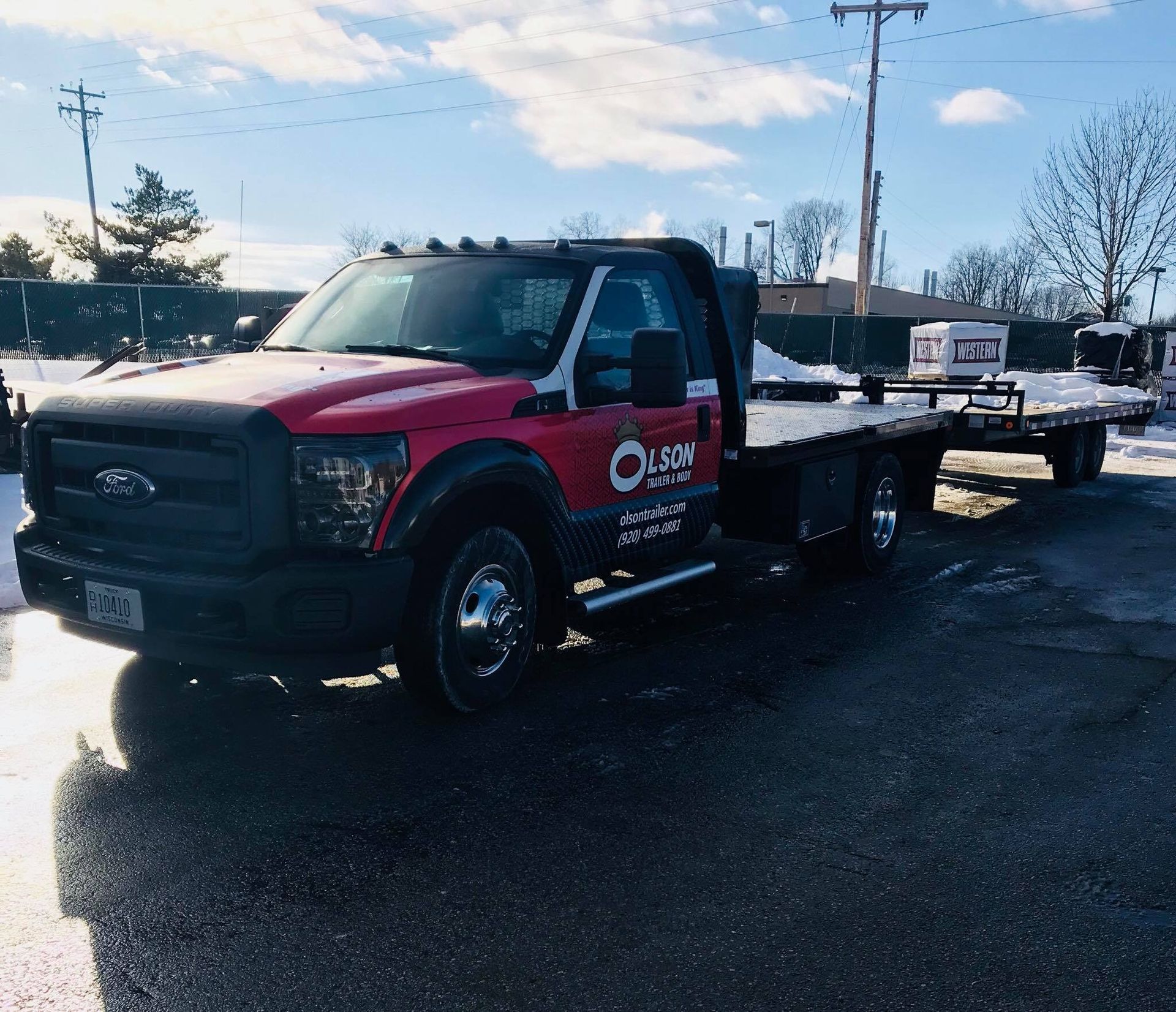A red tow truck with the word ocean on the side