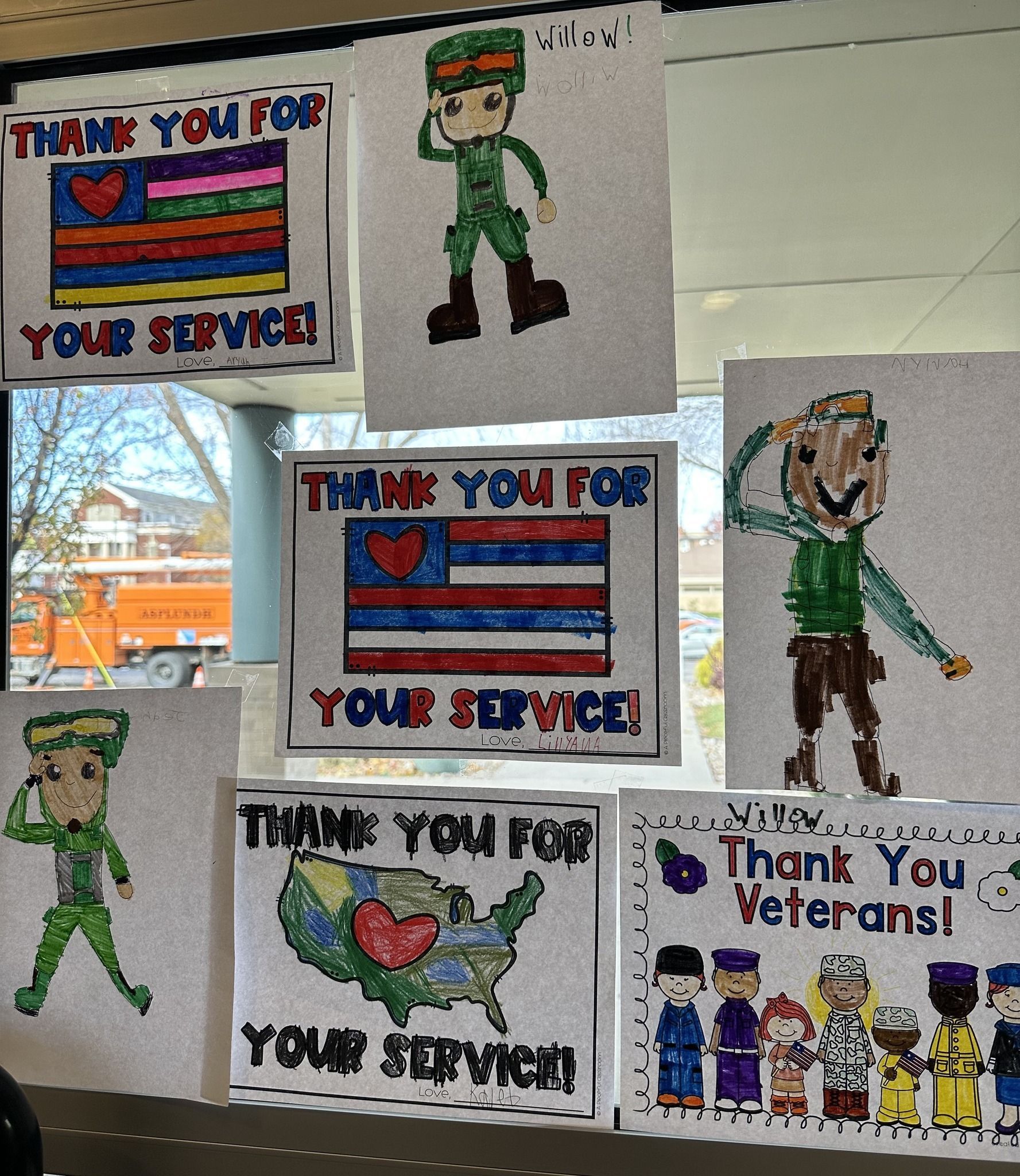 Cards thanking veterans: American flags, drawings of soldiers saluting, and a group of people.