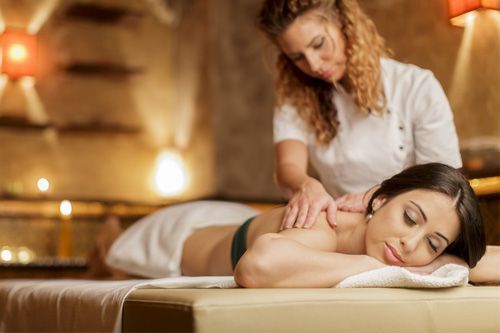 A woman is getting a massage at a spa.