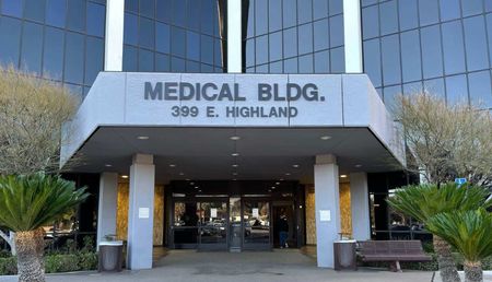 A large building with a sign that says medical bldg 399 e highland