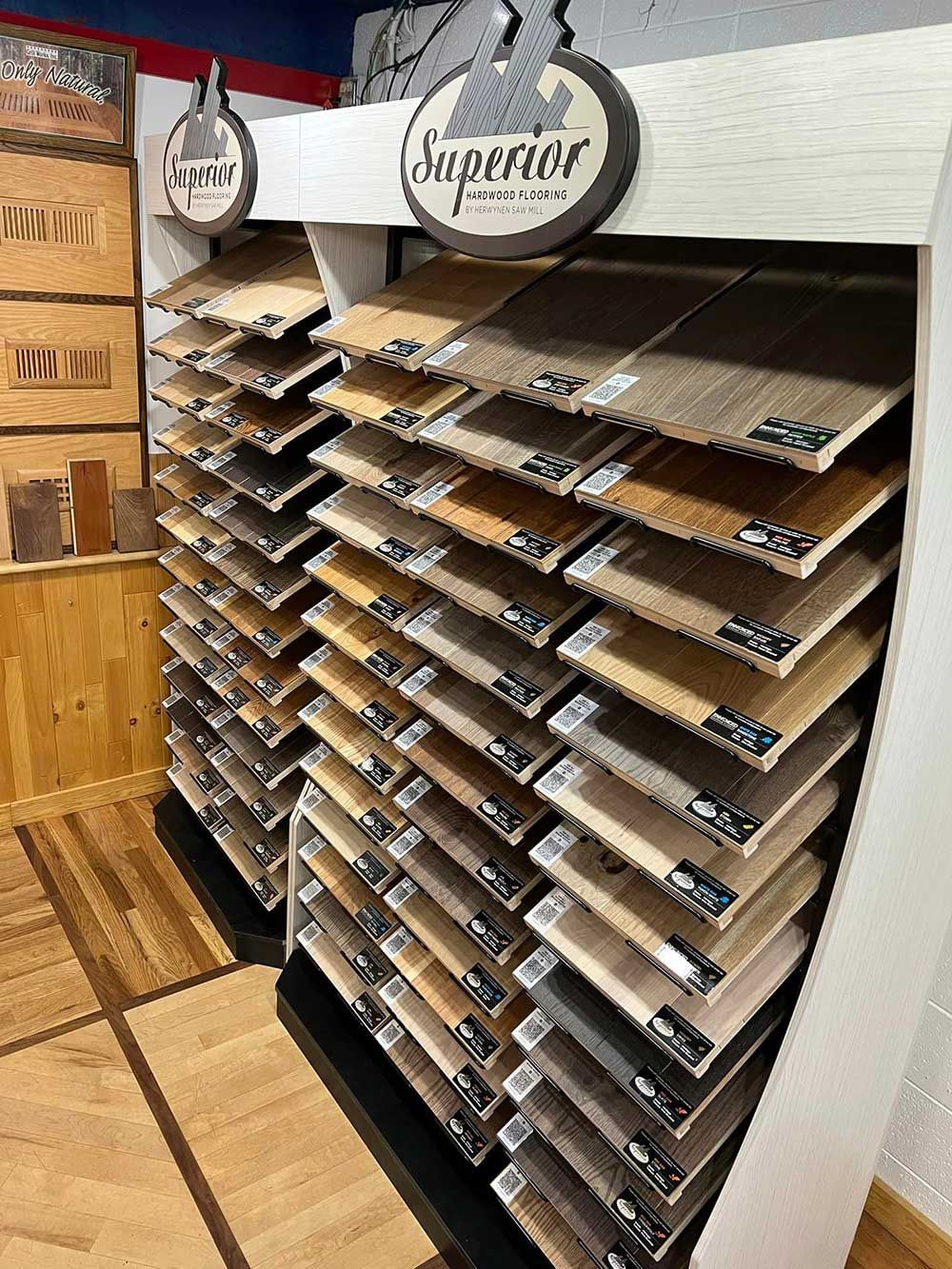 A display case filled with lots of different types of wooden flooring.