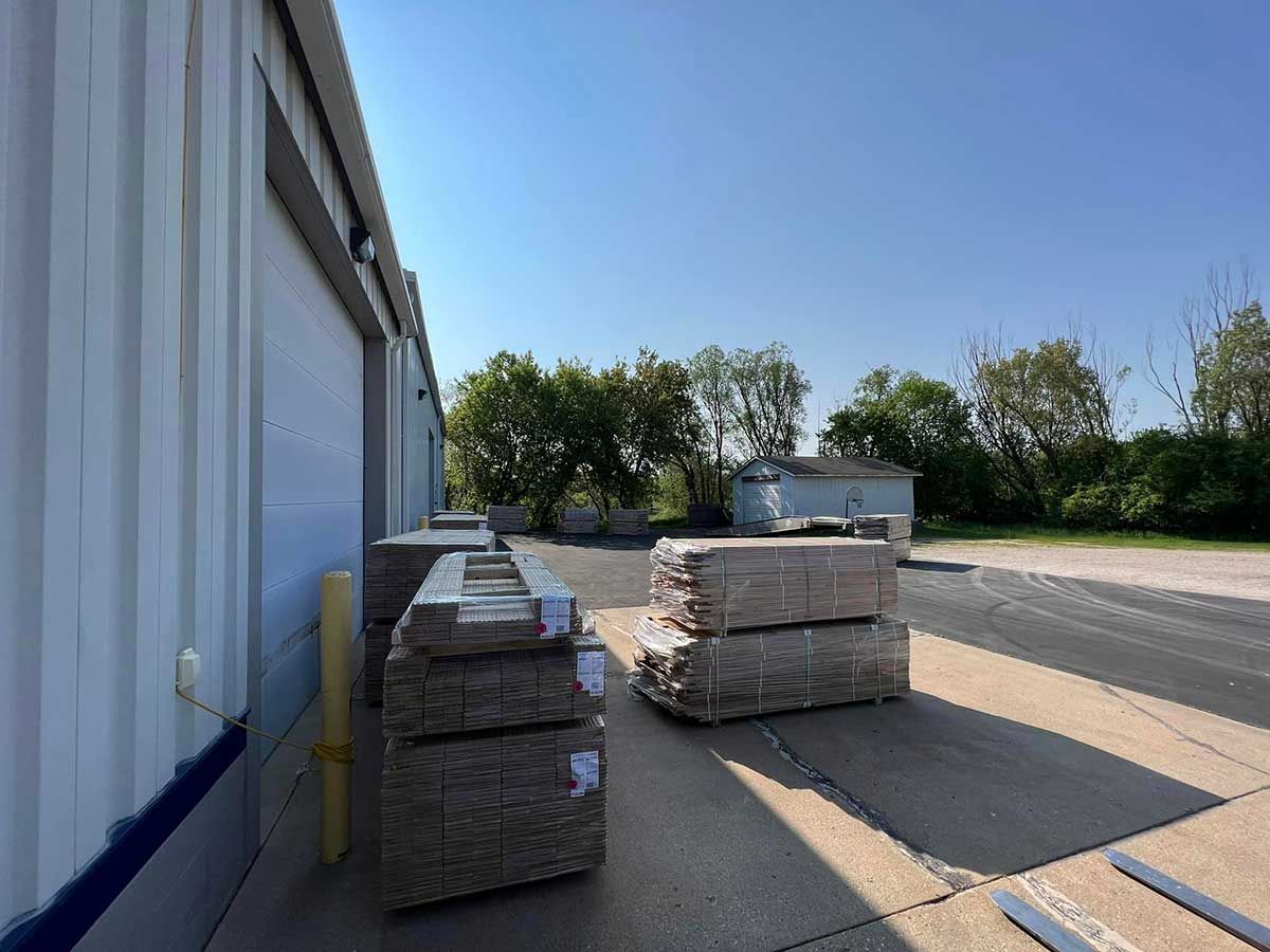 A warehouse with a lot of boxes stacked on top of each other.