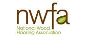 Logo of the National Wood Flooring Association with brown text and a green leaf inside the lowercase letter a.