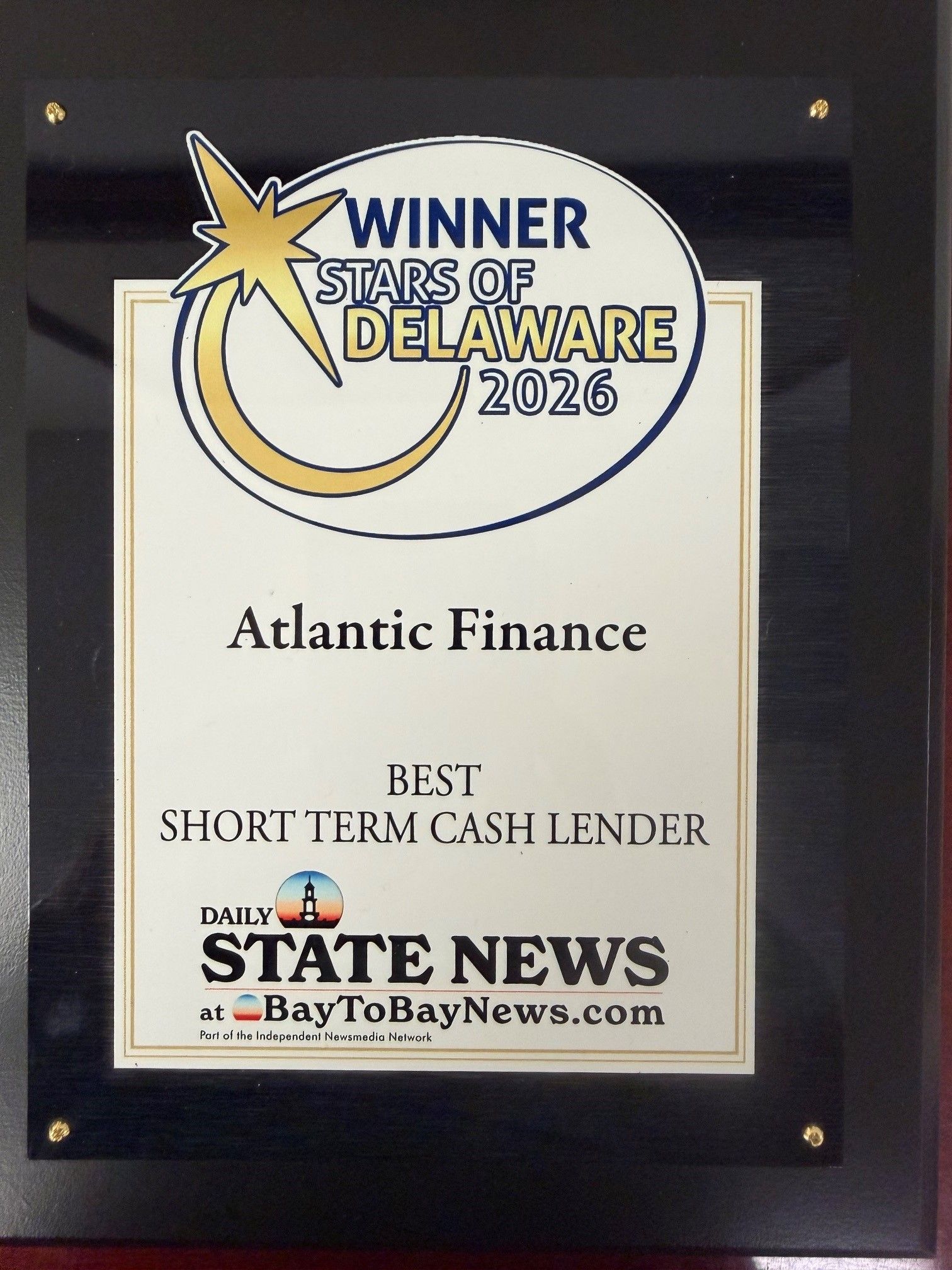 Plaque reading “Winner Stars of Delaware 2026” for Atlantic Finance, best short-term cash lender, from Delaware State News