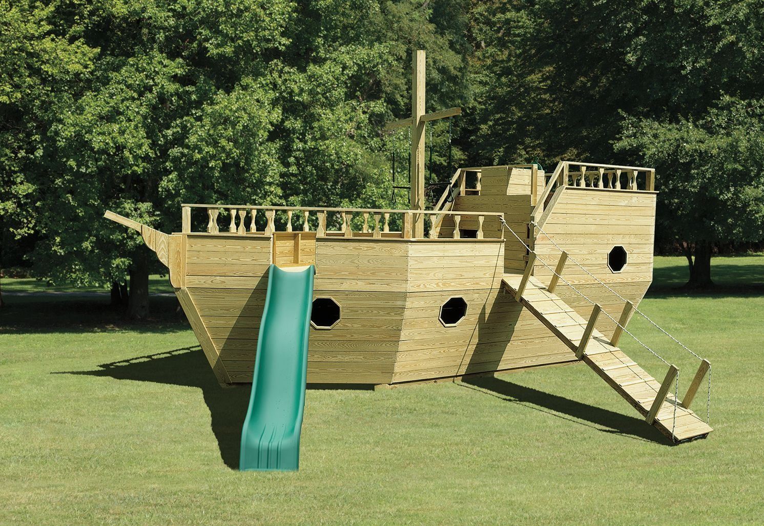 A wooden pirate ship playground with a slide and stairs