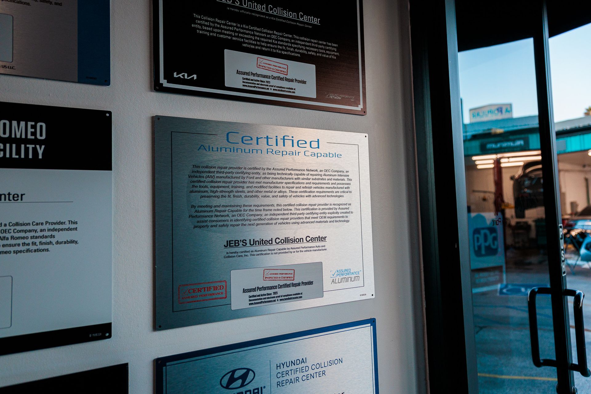 A sign on a wall that says certified on it