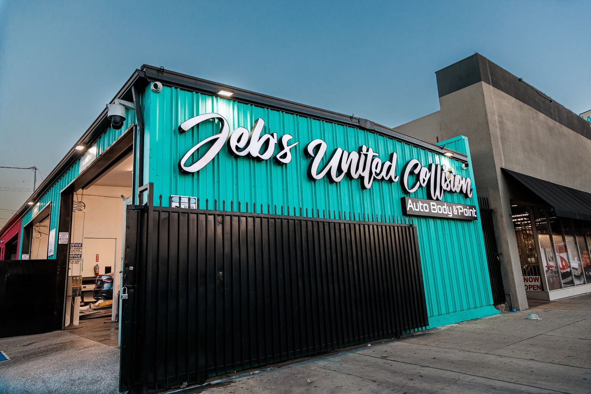 A blue and black building with a sign that says jobs united on it.