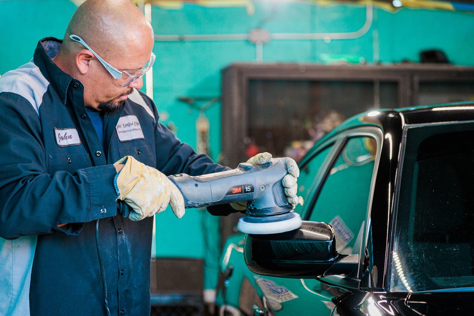 A man is polishing a car