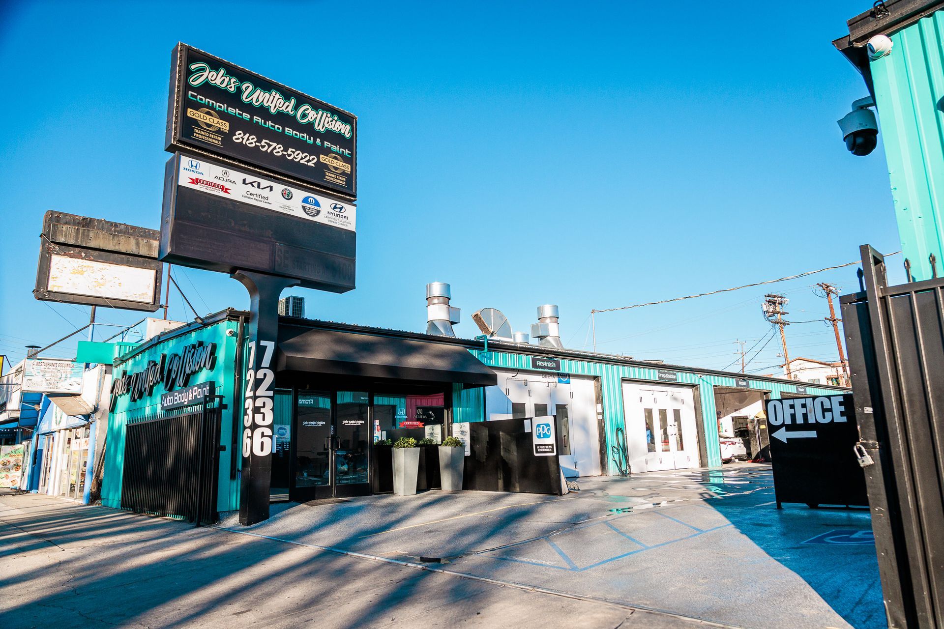 A blue building with a sign that says office on it