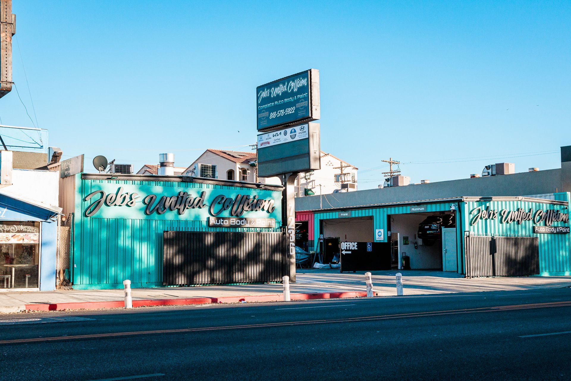 A building with a sign that says juice waffle coffee