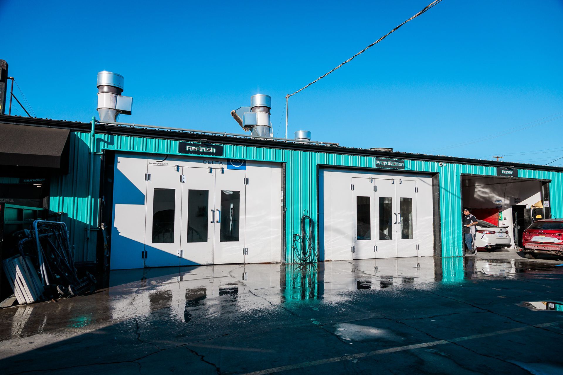 Building with cars parked in front of it