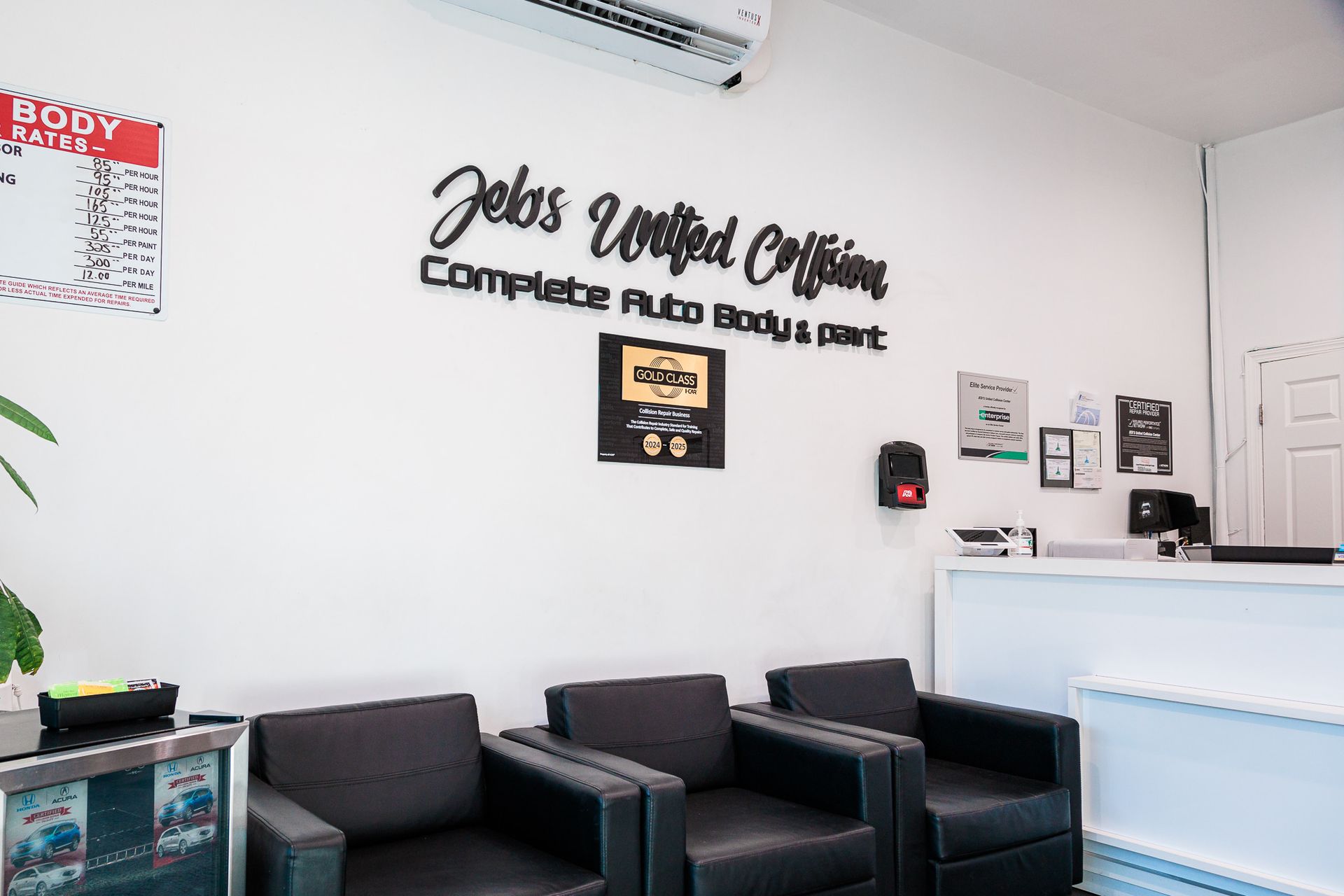 A waiting room with chairs and a sign that says Jebs United Collision Center