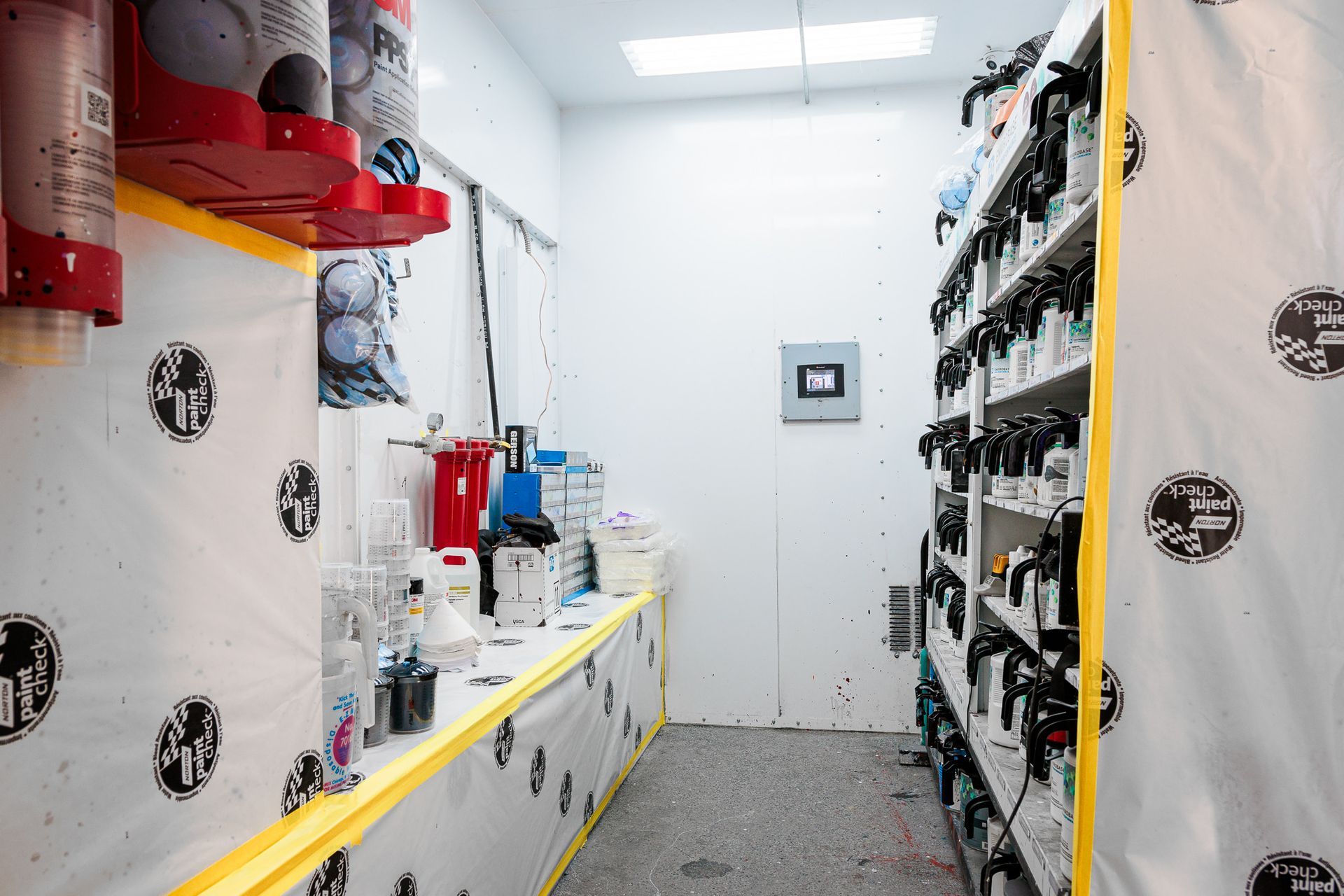 A room with a lot of shelves and bottles on them