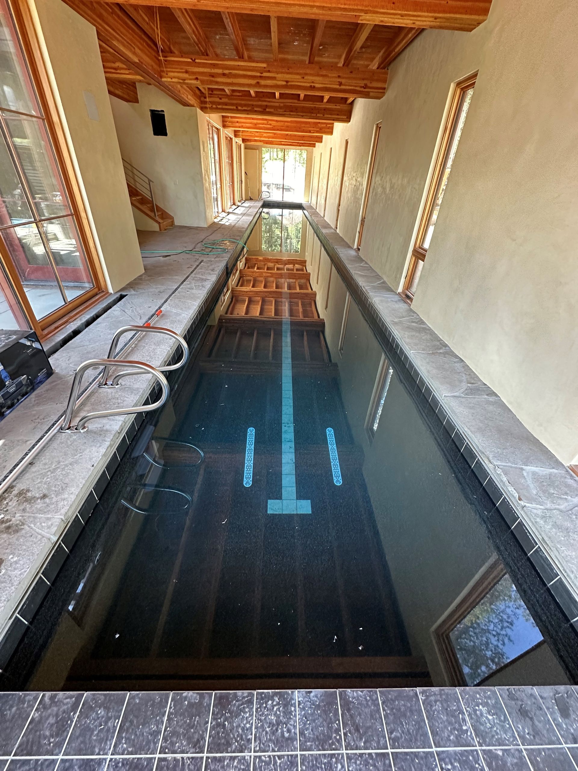 A large swimming pool is being built in a house.