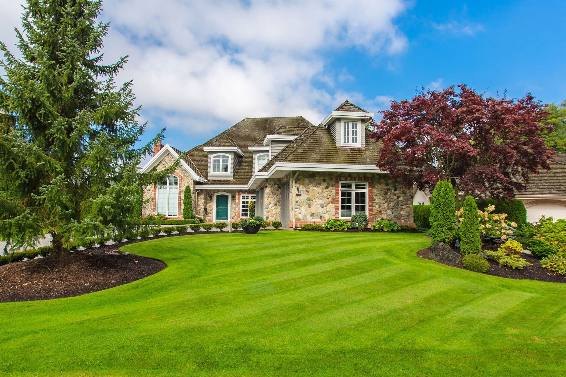 house with large green lawn