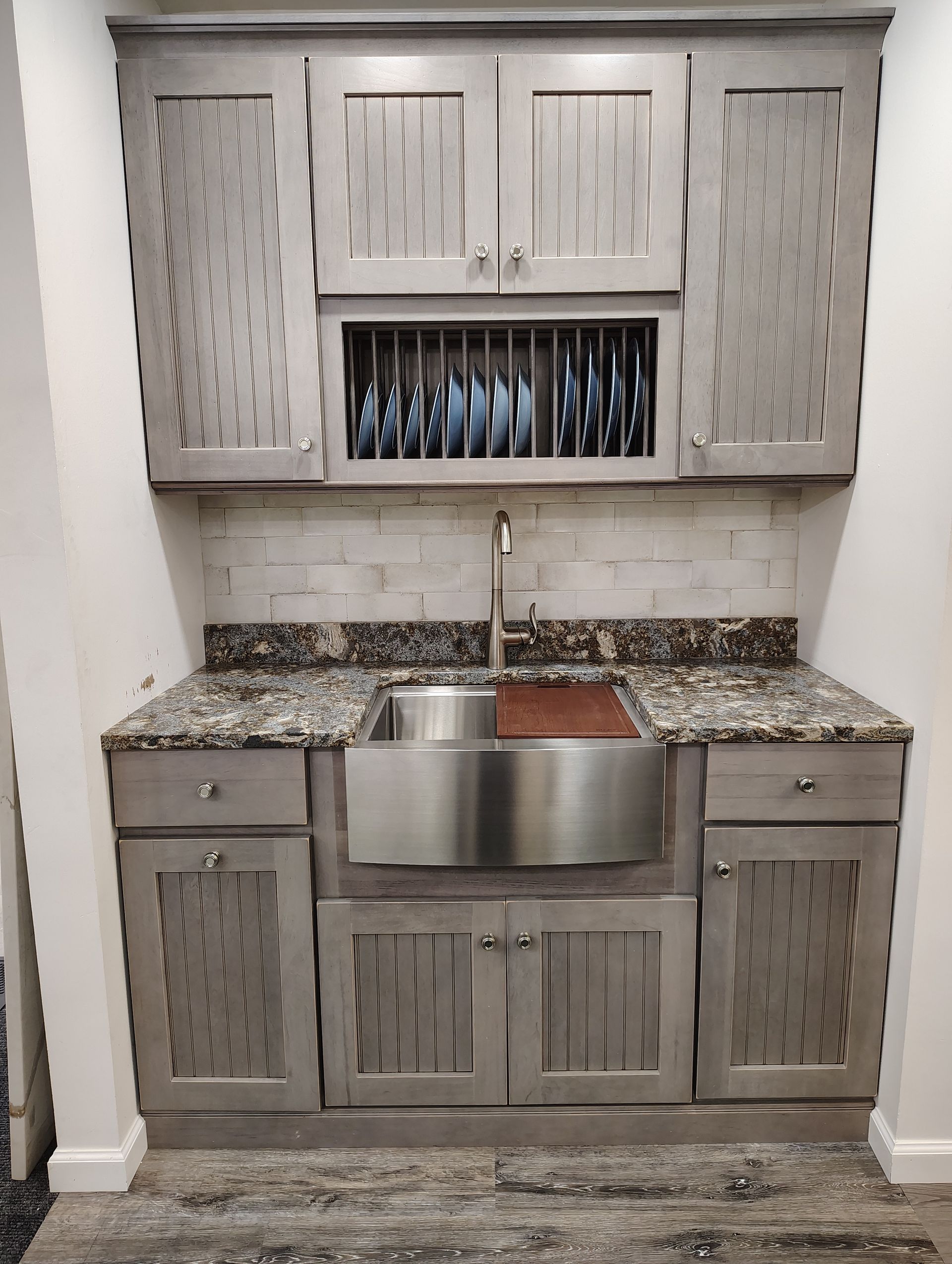 A kitchen with stainless steel cabinets and a sink