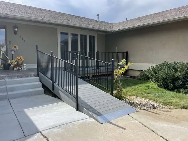 There is a ramp leading to the front of the house.