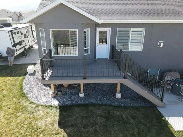 An aerial view of a house with a large deck.