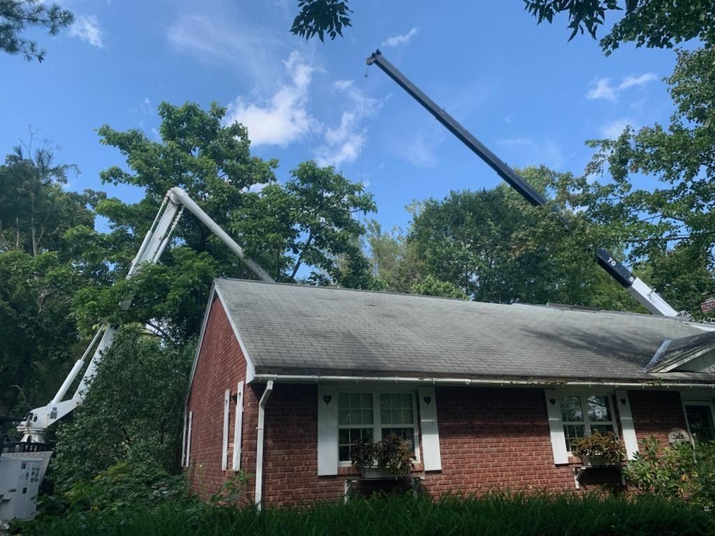 A brick house with a crane on top of it.