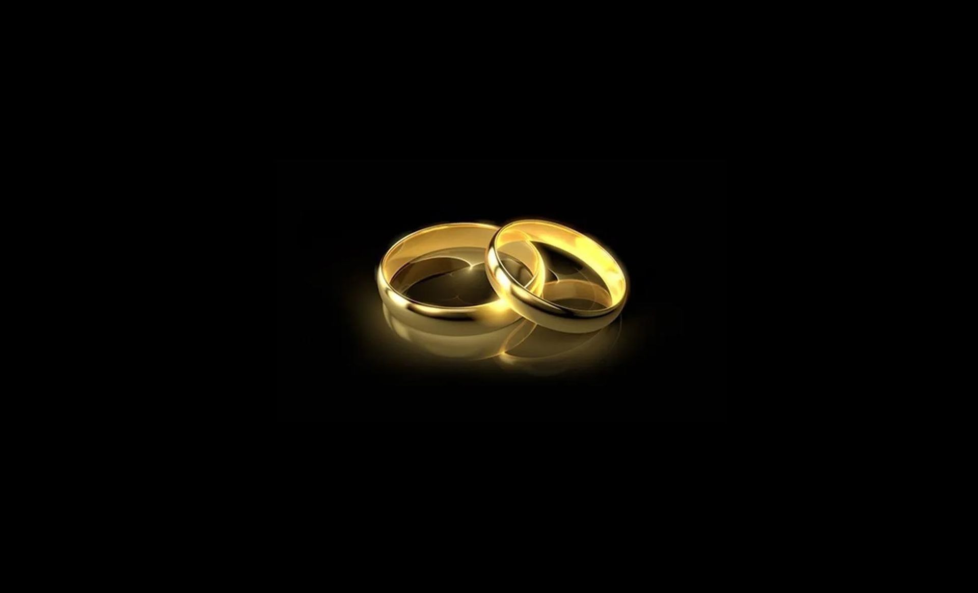 a pair of gold wedding bands