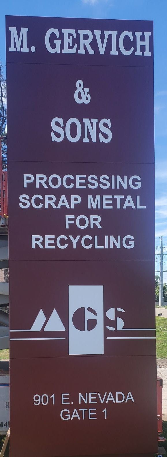 A sign for M. Gervick & Sons processing scrap metal for recycling
