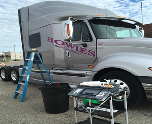 A howies semi truck is parked in a parking lot