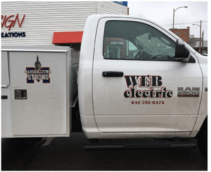 A white truck with the word electric on the side