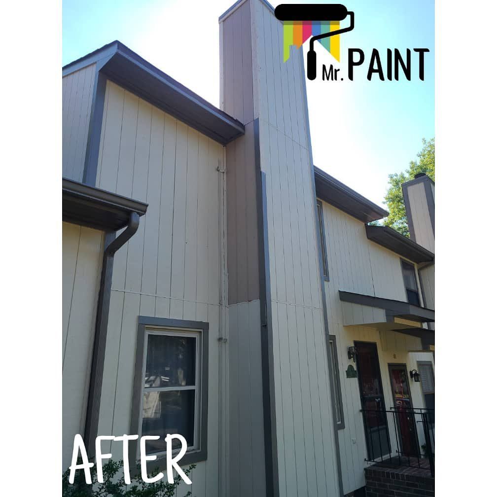 Newly painted house exterior in light beige with brown trim. 