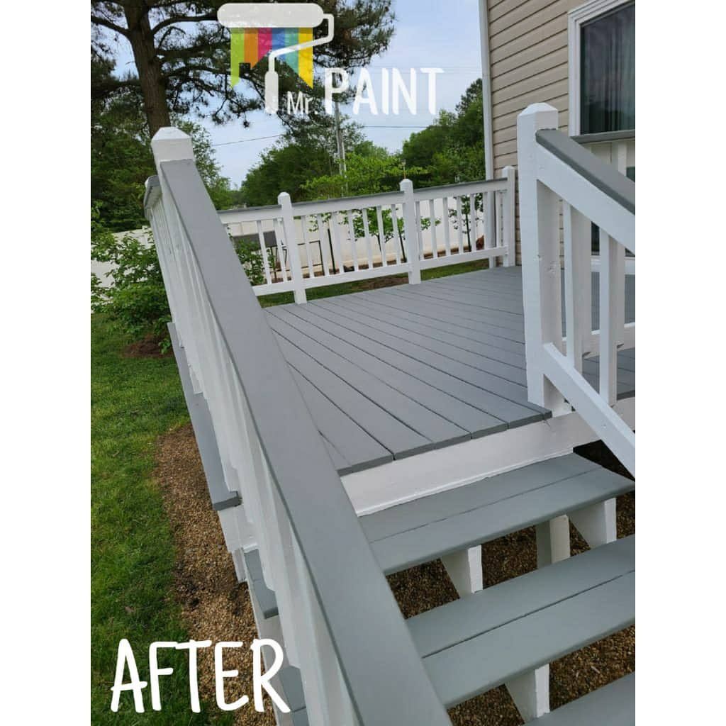 Newly painted gray deck and white railing. 