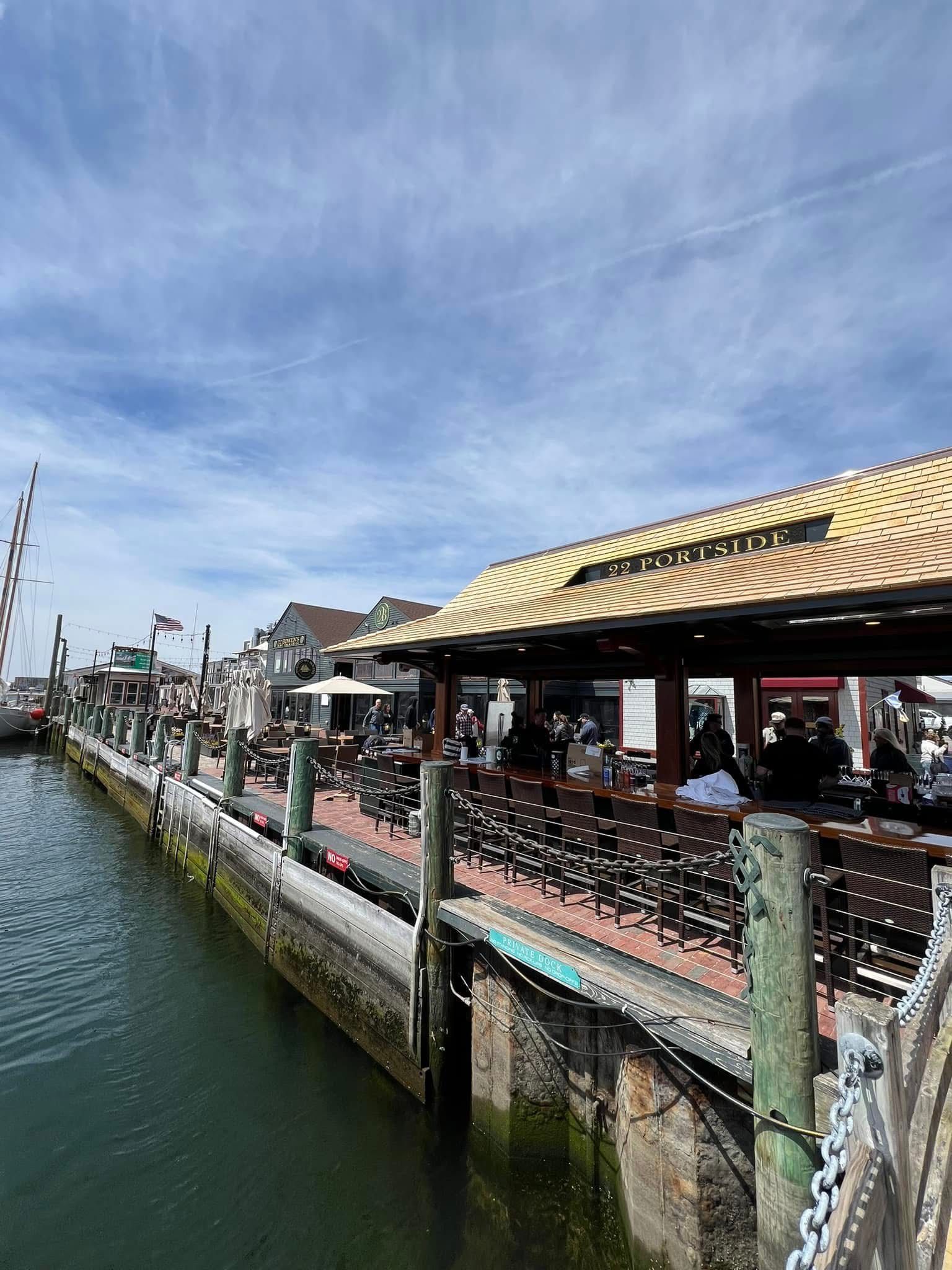 Restaurant patio on a pier with people dining