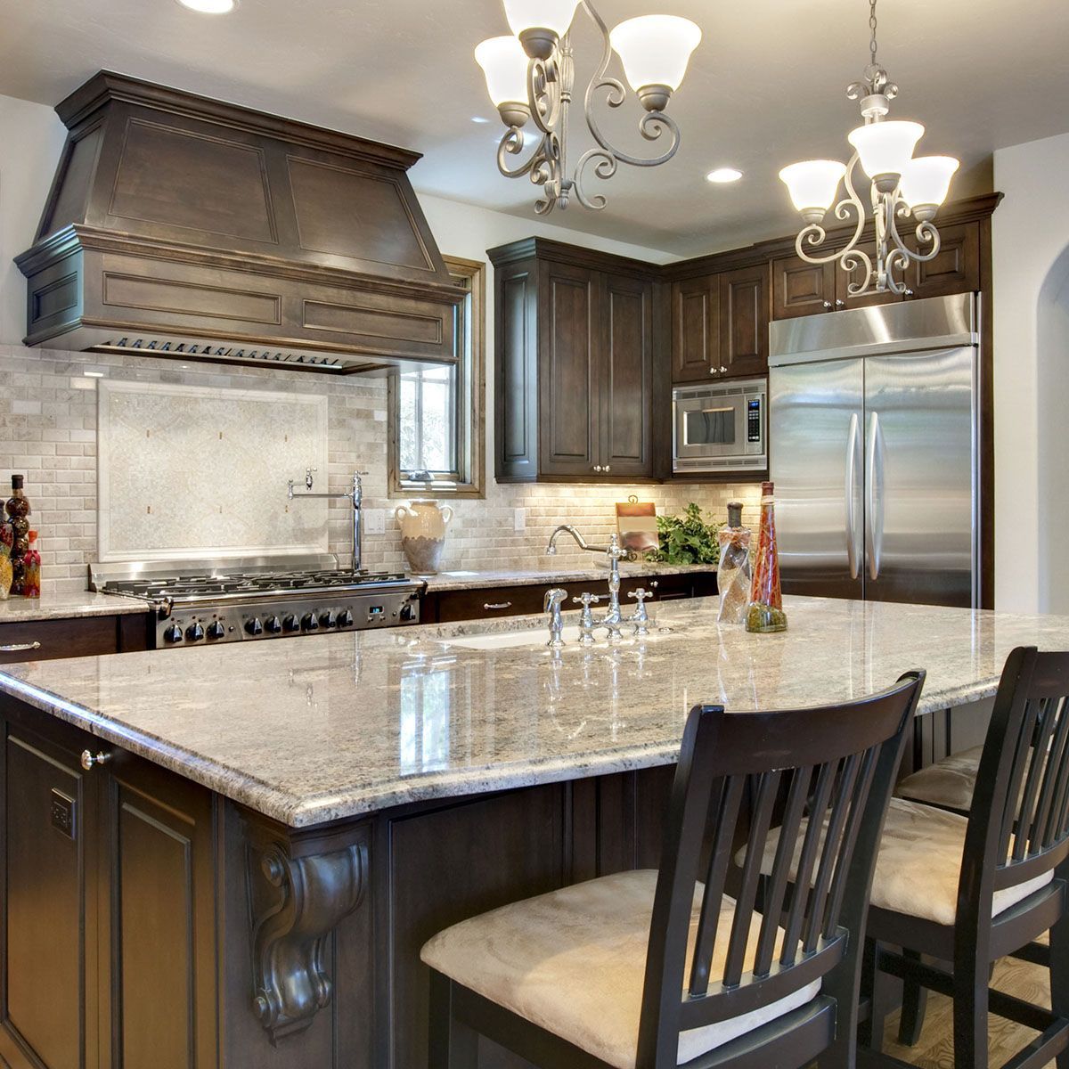 A kitchen with stainless steel appliances and granite countertops