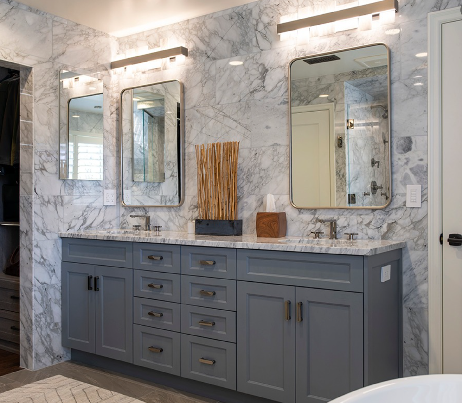 A bathroom with two sinks, two mirrors, and a bathtub.