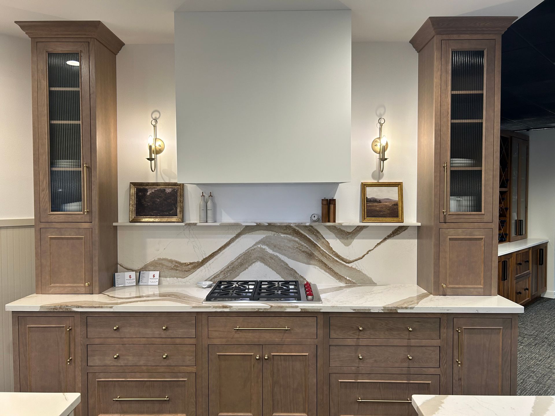 A kitchen with wooden cabinets and a stove top oven.