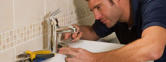 Plumbing fixing the bathroom faucet