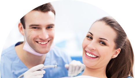 Patient and dentist smiling